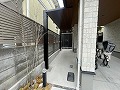 世田谷区代沢Y様邸の駐輪場スペースに屋根と物置を設置した画像